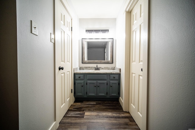 2330 Tyler St, Conway, AR 72034 - hallway featuring dark wood-style flooring and a sink