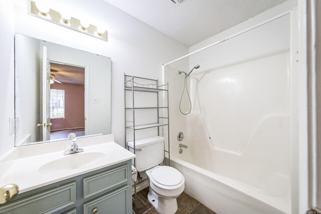1117 Troy Dr, Benton, AR 72019 - bathroom with toilet, vanity, tub / shower combination, and a textured ceiling