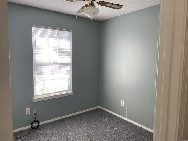 1117 Troy Dr, Benton, AR 72019 - empty room with dark colored carpet, ceiling fan, a textured ceiling, and baseboards