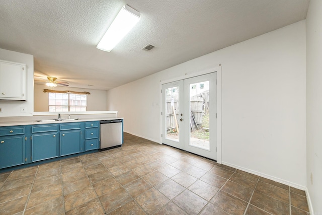 1117 Troy Dr, Benton, AR 72019 - kitchen with dishwasher, blue cabinetry, a sink, french doors, and a textured ceiling