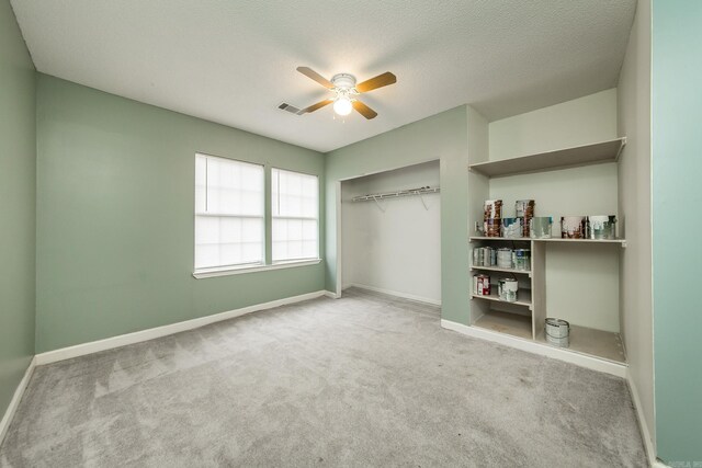 1117 Troy Dr, Benton, AR 72019 - unfurnished bedroom featuring carpet, baseboards, a closet, and a textured ceiling