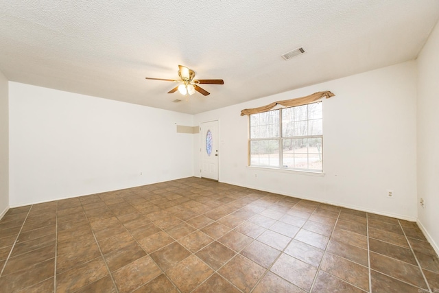 1117 Troy Dr, Benton, AR 72019 - unfurnished room featuring a ceiling fan and a textured ceiling