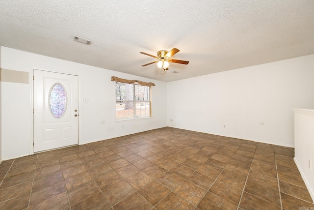 1117 Troy Dr, Benton, AR 72019 - entrance foyer with a ceiling fan and a textured ceiling
