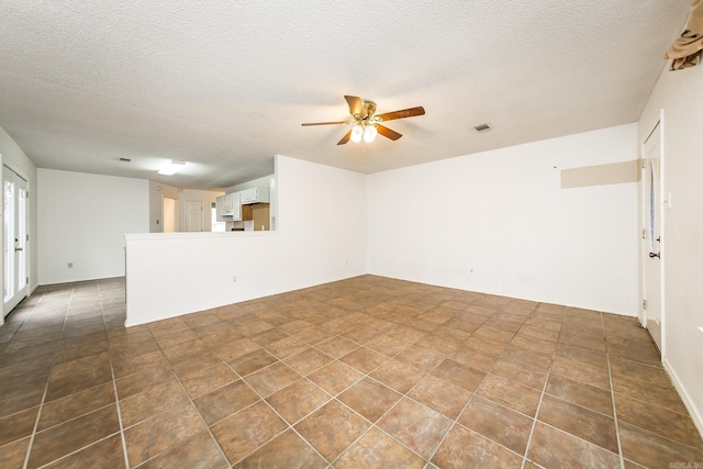 1117 Troy Dr, Benton, AR 72019 - unfurnished living room with ceiling fan and a textured ceiling