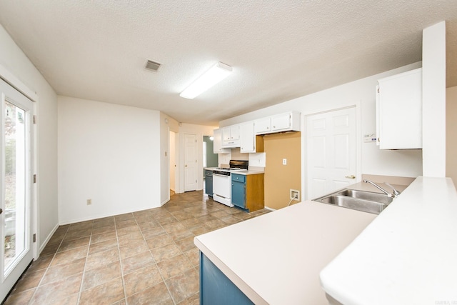 1117 Troy Dr, Benton, AR 72019 - kitchen with white gas range oven, a sink, white cabinets, light countertops, and a textured ceiling