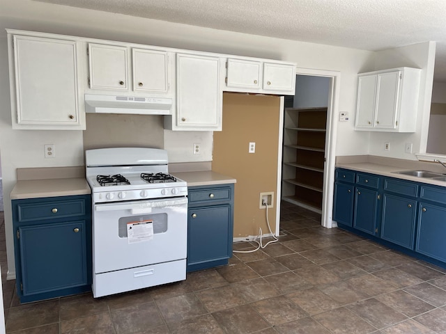 1117 Troy Dr, Benton, AR 72019 - kitchen featuring white range with gas cooktop, blue cabinets, under cabinet range hood, a sink, and white cabinets