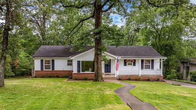 7521 Gable, Little Rock, AR 72205 - single story home featuring a porch, a front lawn, and brick siding