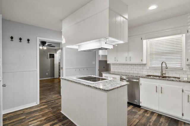 kitchen featuring a sink, stainless steel dishwasher, white electric stovetop, dark wood finished floors, and wainscoting