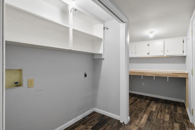 laundry room featuring electric dryer hookup, hookup for a washing machine, dark wood-style floors, and baseboards