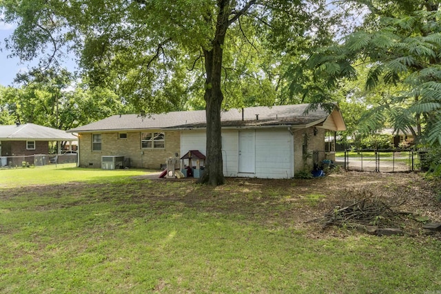 rear view of property with brick siding and central AC unit