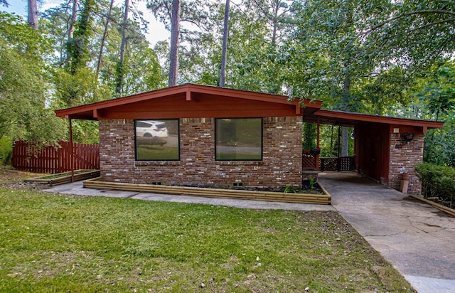 18 Woodcliff Cir, Little Rock, AR 72204 - view of front facade with brick siding and concrete driveway