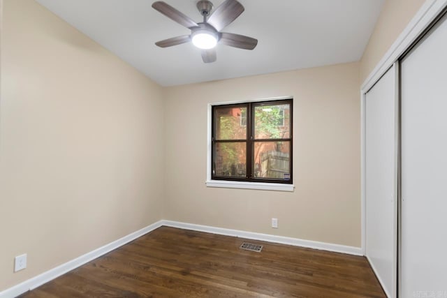18 Woodcliff Cir, Little Rock, AR 72204 - unfurnished bedroom featuring baseboards, a closet, dark wood finished floors, and ceiling fan