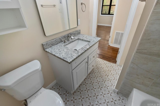 18 Woodcliff Cir, Little Rock, AR 72204 - full bathroom featuring vanity, baseboards, toilet, and a tub to relax in