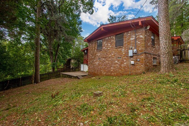 18 Woodcliff Cir, Little Rock, AR 72204 - view of side of home with a deck and brick siding