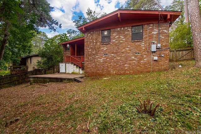 18 Woodcliff Cir, Little Rock, AR 72204 - back of property with a wooden deck and brick siding