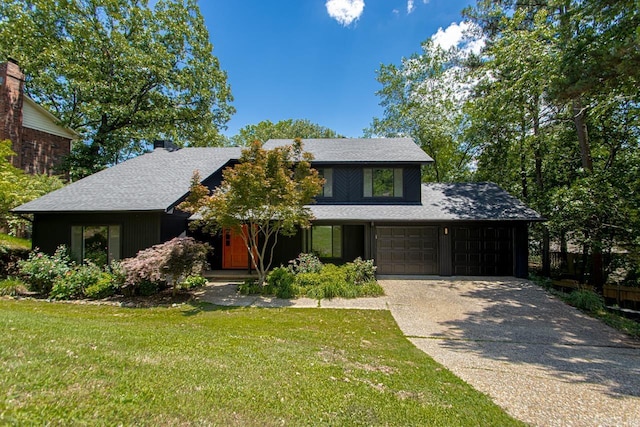 3 Poydras Dr, Little Rock, AR 72211 - view of front of house featuring a front yard, driveway, roof with shingles, and a garage