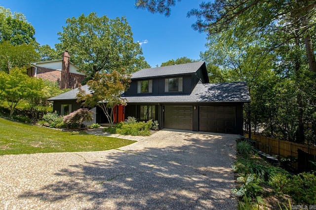 3 Poydras Dr, Little Rock, AR 72211 - view of front facade with driveway and a shingled roof