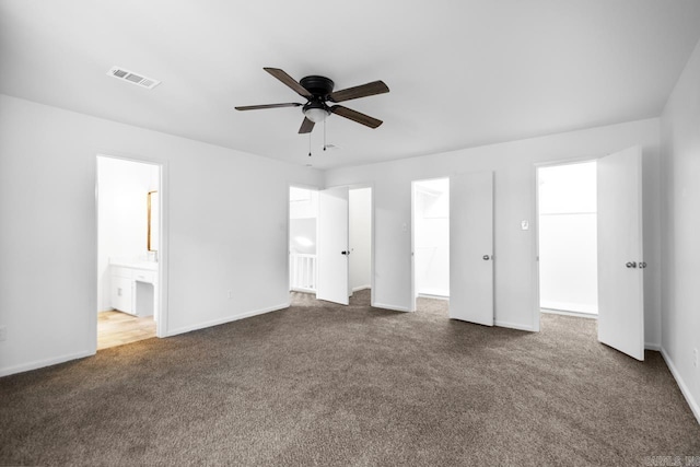 3 Poydras Dr, Little Rock, AR 72211 - unfurnished bedroom with dark carpet, baseboards, ensuite bathroom, and ceiling fan