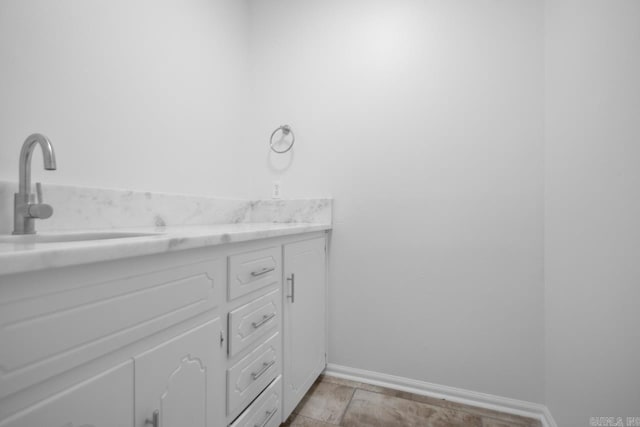 3 Poydras Dr, Little Rock, AR 72211 - bathroom featuring baseboards and double vanity