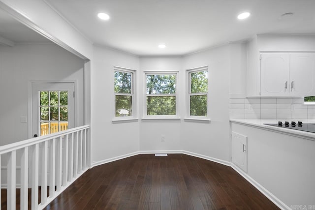 3 Poydras Dr, Little Rock, AR 72211 - unfurnished dining area featuring dark wood-type flooring, baseboards, recessed lighting, and crown molding