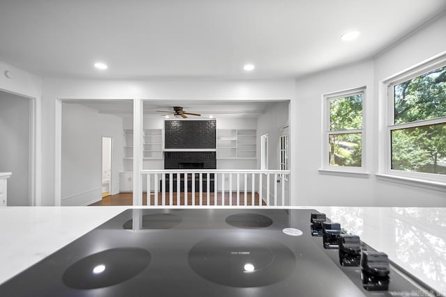 3 Poydras Dr, Little Rock, AR 72211 - detailed view of ceiling fan, a fireplace, recessed lighting, and wood finished floors