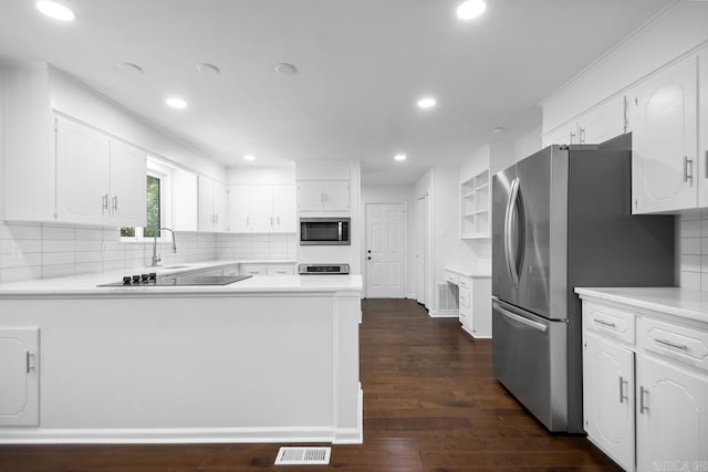 3 Poydras Dr, Little Rock, AR 72211 - kitchen featuring appliances with stainless steel finishes, recessed lighting, a peninsula, and white cabinets