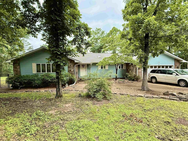 single story home with a garage