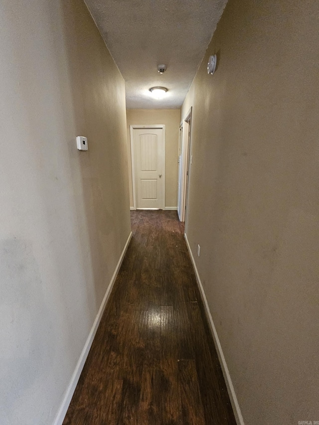216 Plum Dr, Austin, AR 72023 - corridor with wood finished floors and baseboards