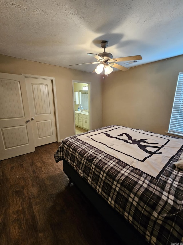 216 Plum Dr, Austin, AR 72023 - bedroom featuring wood finished floors, ceiling fan, and connected bathroom
