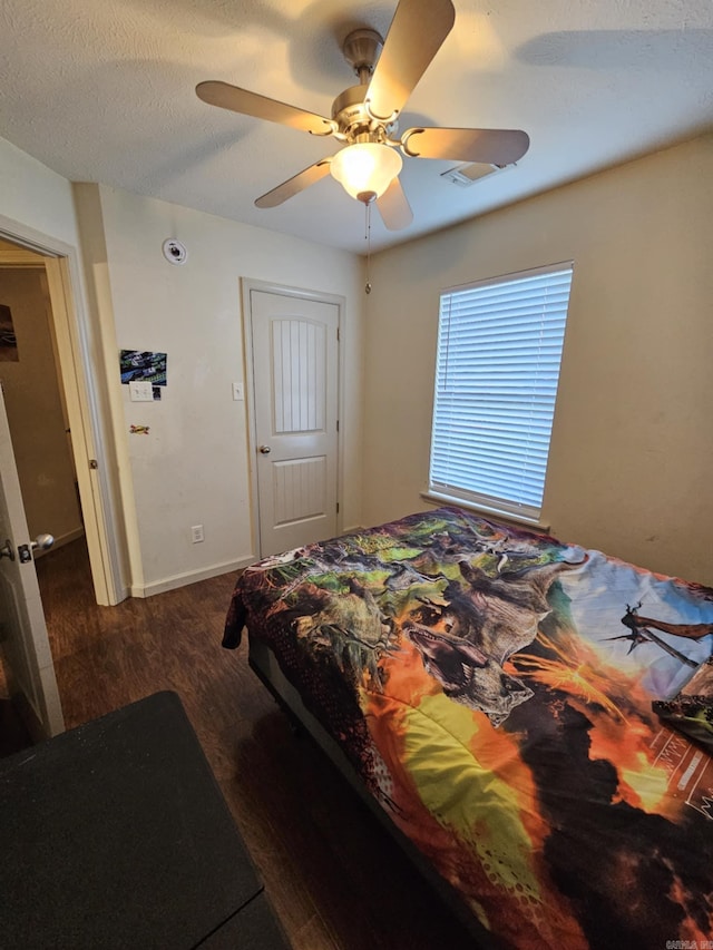 216 Plum Dr, Austin, AR 72023 - bedroom featuring wood finished floors, a ceiling fan, and baseboards