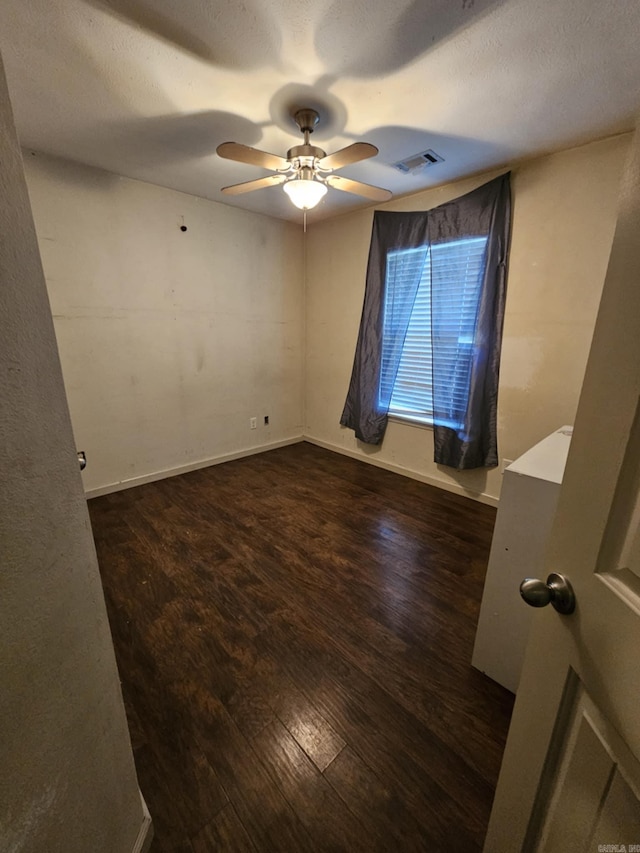 216 Plum Dr, Austin, AR 72023 - empty room featuring ceiling fan, wood finished floors, and baseboards