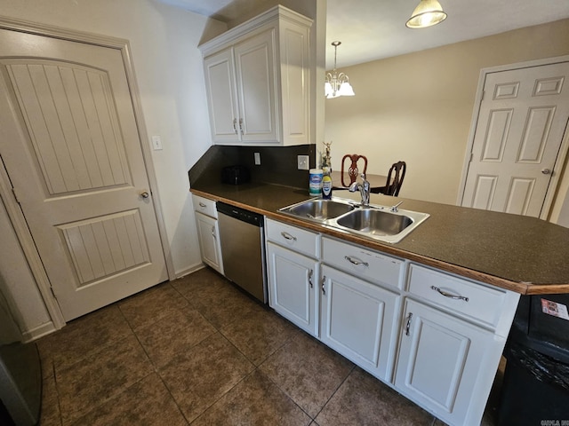216 Plum Dr, Austin, AR 72023 - kitchen with stainless steel dishwasher, a sink, dark countertops, a peninsula, and white cabinets
