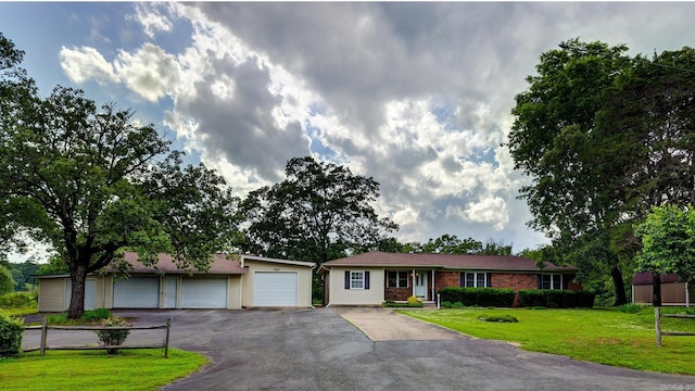 3508 Jack Mann Rd, Little Rock, AR 72210 - ranch-style home with a front lawn and asphalt driveway