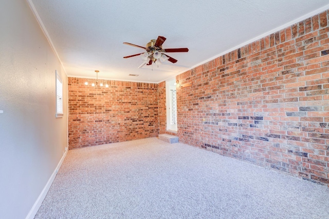 3508 Jack Mann Rd, Little Rock, AR 72210 - carpeted empty room featuring ceiling fan, brick wall, ornamental molding, and baseboards