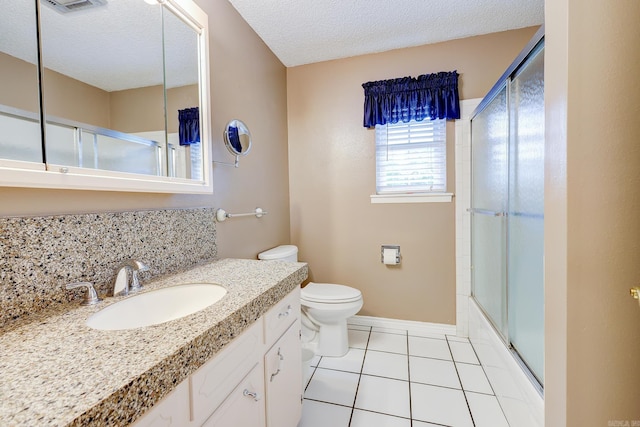 3508 Jack Mann Rd, Little Rock, AR 72210 - full bath with tile patterned flooring, vanity, toilet, a textured ceiling, and shower / bath combination with glass door
