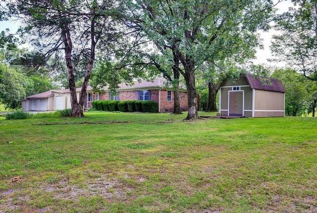 3508 Jack Mann Rd, Little Rock, AR 72210 - view of green lawn featuring a garage
