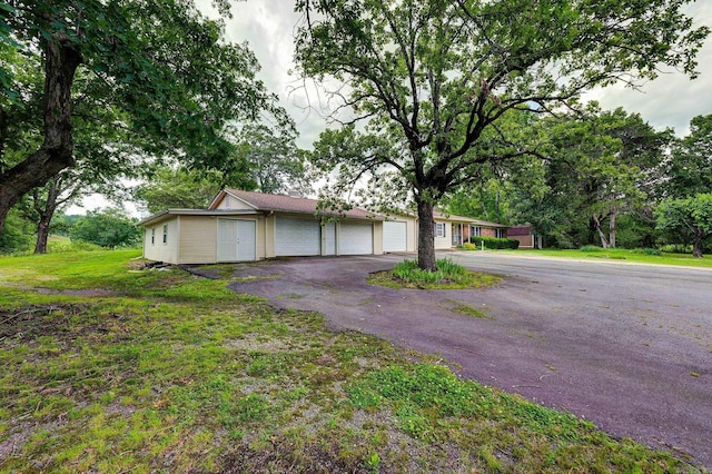 3508 Jack Mann Rd, Little Rock, AR 72210 - ranch-style home featuring an attached garage and driveway