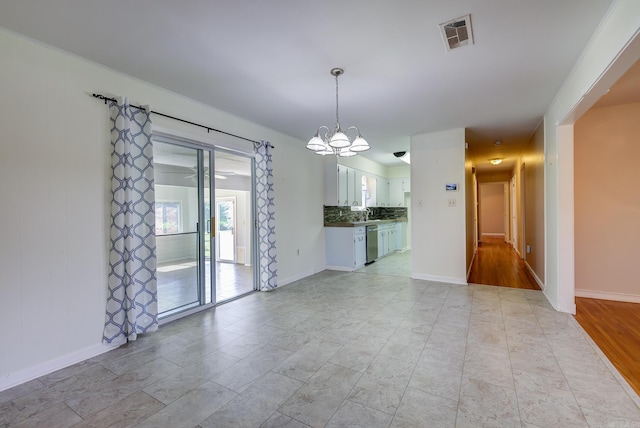 3508 Jack Mann Rd, Little Rock, AR 72210 - empty room with a chandelier and baseboards