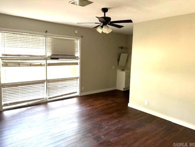301 Coil, Steele, MO 63877 - spare room with baseboards, a ceiling fan, and wood finished floors