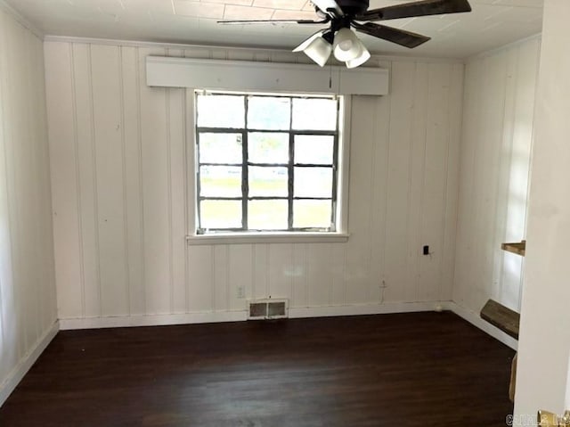 301 Coil, Steele, MO 63877 - spare room with dark wood-style flooring, a ceiling fan, and baseboards