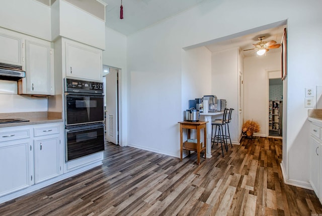3110 Edison Ave, Benton, AR 72015 - kitchen with black appliances, dark wood-style floors, ceiling fan, and light countertops