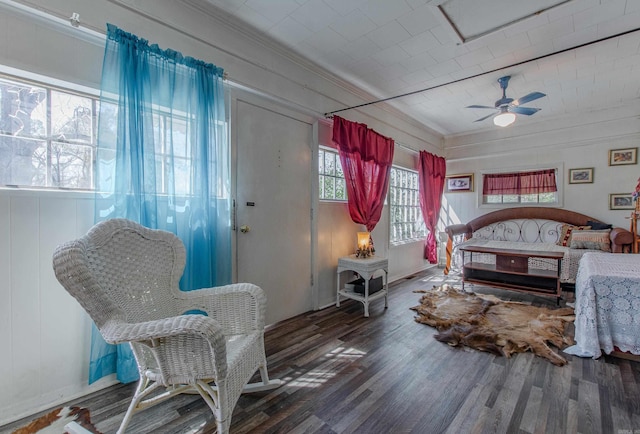 3110 Edison Ave, Benton, AR 72015 - bedroom with crown molding, wood finished floors, a wood stove, and a ceiling fan