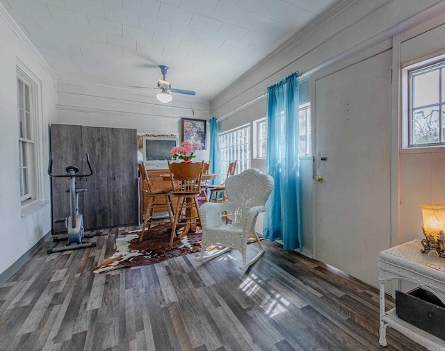 3110 Edison Ave, Benton, AR 72015 - living area with ornamental molding, healthy amount of natural light, wood finished floors, ceiling fan, and a wood stove