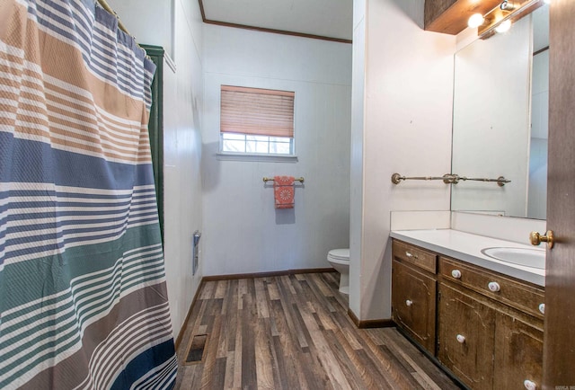3110 Edison Ave, Benton, AR 72015 - bathroom featuring wood finished floors, toilet, vanity, baseboards, and curtained shower