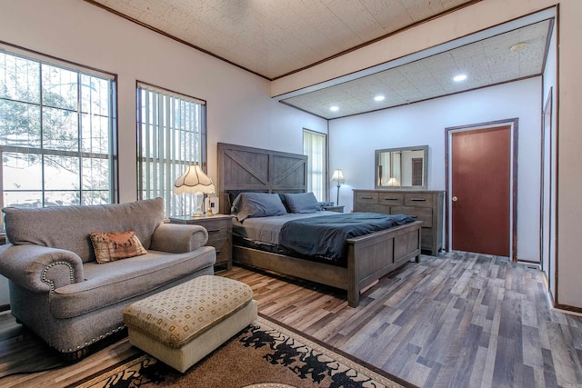 3110 Edison Ave, Benton, AR 72015 - bedroom with wood finished floors, multiple windows, crown molding, and recessed lighting