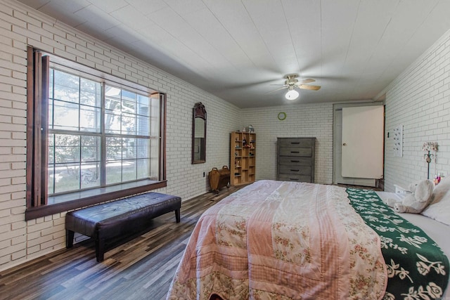3110 Edison Ave, Benton, AR 72015 - bedroom with brick wall, wood finished floors, and ceiling fan