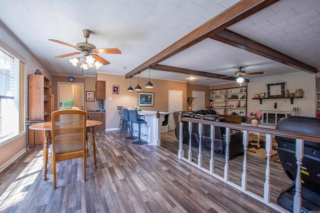3110 Edison Ave, Benton, AR 72015 - dining room featuring a ceiling fan, baseboards, wood finished floors, and beamed ceiling