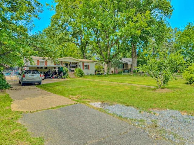 3106 Edison Ave, Benton, AR 72015 - view of grassy yard featuring driveway