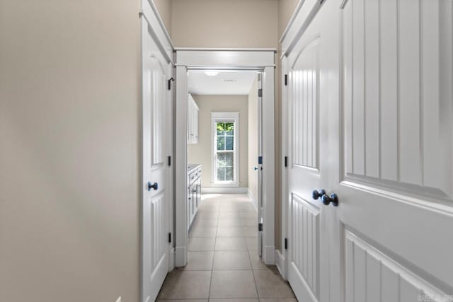5611 Pear Tree Dr, Little Rock, AR 72206 - corridor featuring baseboards and light tile patterned flooring