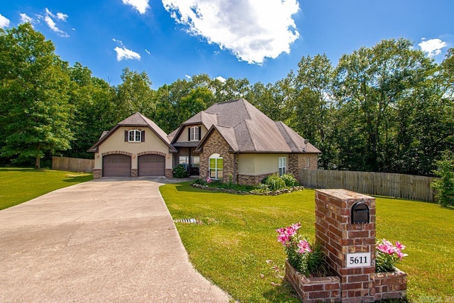 5611 Pear Tree Dr, Little Rock, AR 72206 - view of front of home featuring stone siding, stucco siding, and driveway